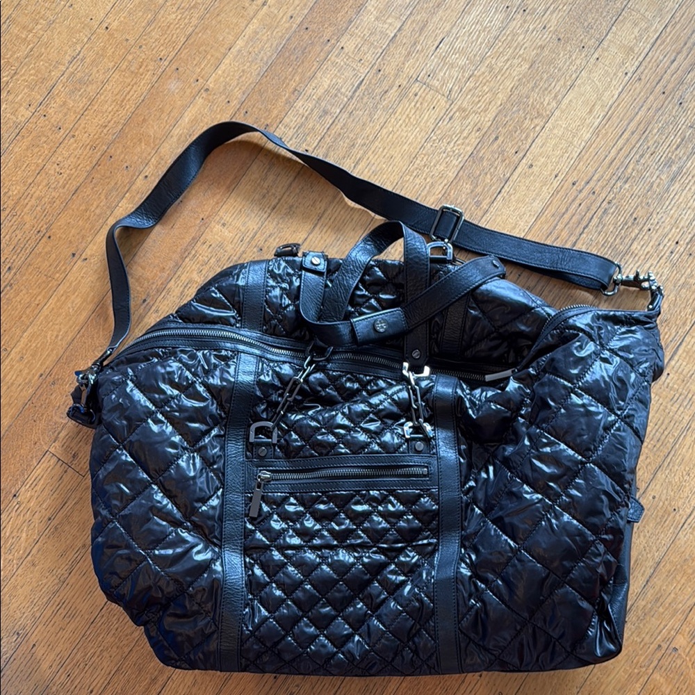 Tory Burch Elegant Black Quilted Travel Bag